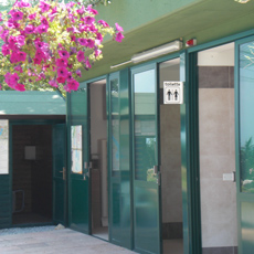 Bathing area with men's, women's, and handicapped-access bathrooms and 3 showers