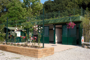 Bathing area with men's, women's, and handicapped-access bathrooms and 3 showers